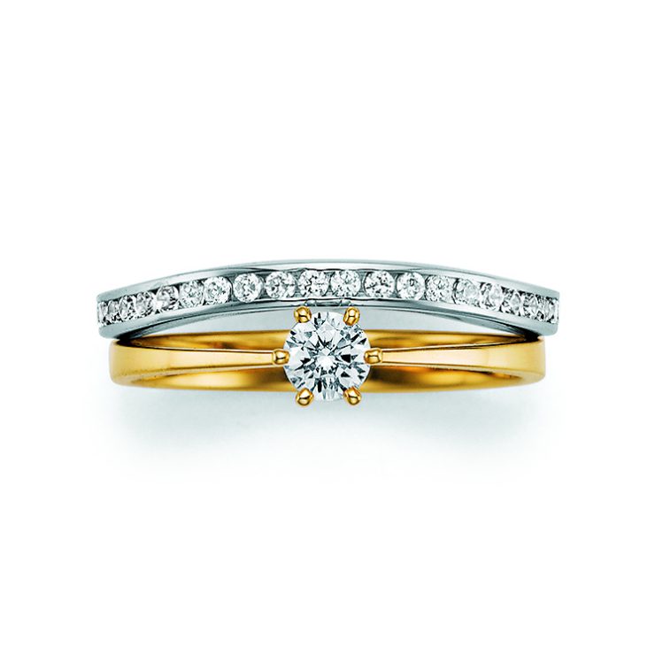 Eleganter Verlobungsring in Gelb- und Weißgold mit zentralem Brillanten in Krappenfassung und pavégefasster Diamantschiene für zeitlose Brillanz