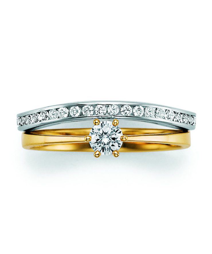 Eleganter Verlobungsring in Gelb- und Weißgold mit zentralem Brillanten in Krappenfassung und pavégefasster Diamantschiene für zeitlose Brillanz